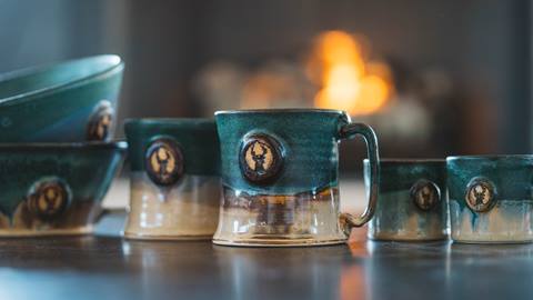 Deer Valley pottery mugs and bowls.