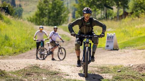 Deer Valley bike coach riding mountain bike.