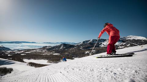 Couple skiing a groomed run at Deer Valley.