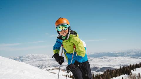 Boy standing on ski run at Deer Valley.