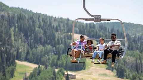 Family on scenic chairlift ride